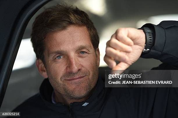 French skipper Eric Bellion poses aboard his class Imoca monohull "Comme un seul homme" on November 2, 2016 in Les Sables-d'Olonne, western France,...