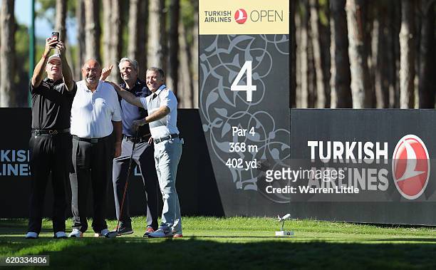 Paul Lawrie of Scotland, Andrew 'Chubby' Chandler, Ahmet Agaoglu and Seda Kalyoncu pose for a selfie on the fourth tee box during the pro-am event...