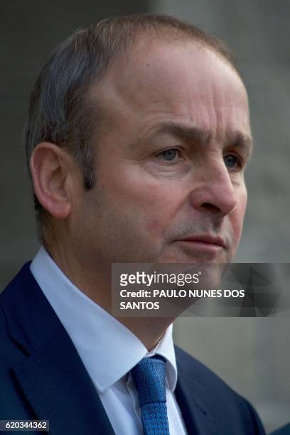 Ireland's opposition Fianna Fail party leader, Micheal Martin, addresses members of the media as he arrives to attend the All-Island Civic Dialogue...