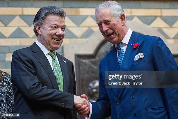 Colombian President Juan Manuel Santos and Prince Charles, Prince of Wales shake hands at the Natural History Museum on November 2, 2016 in London,...