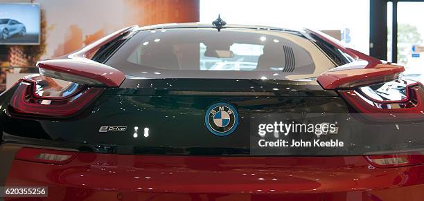 Rear view of a new BMW red and black BMW i8 Edrive hybrid car on October 20, 2016 in Southend, United Kingdom.