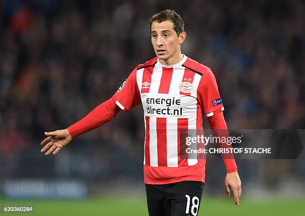 Eindhoven's Mexican midfielder Andres Guardado gestures during the UEFA Champions League group D football match between PSV Eindhoven and Bayern...