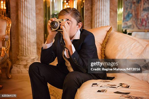 Barron Trump is using the new FUJIFILM instax mini 90 as he is photographed at Trump Tower on January 6, 2016 in New York City.