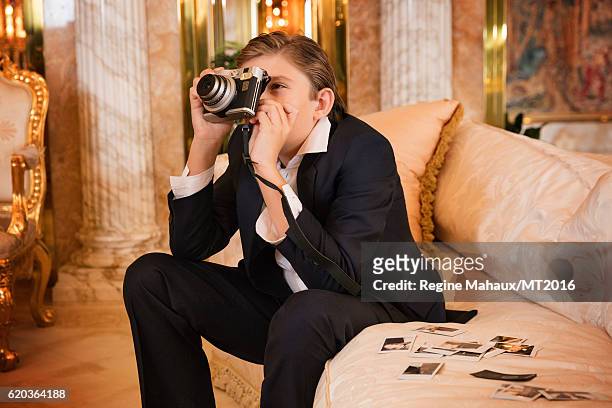 Barron Trump is using the new FUJIFILM instax mini 90 as he is photographed at Trump Tower on January 6, 2016 in New York City.