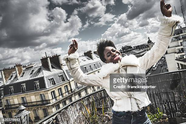 french afro woman have fun on the rooftop - sassy paris stock pictures, royalty-free photos & images