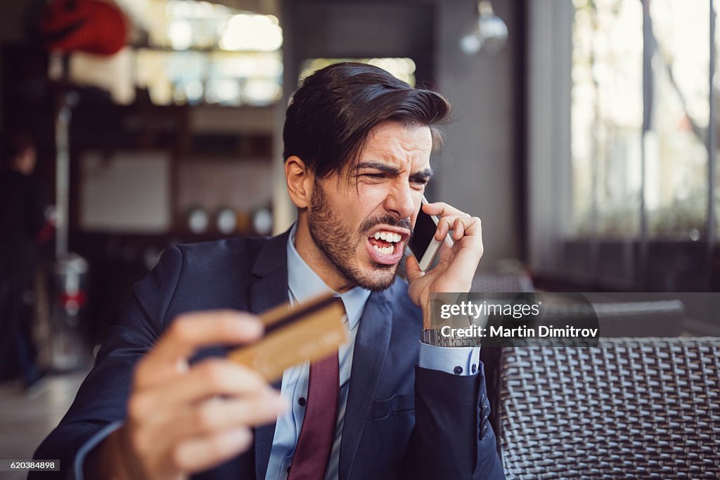 Problem With Credit Card Man Experiencing Problems With His Credit Card High-Res Stock Photo ...