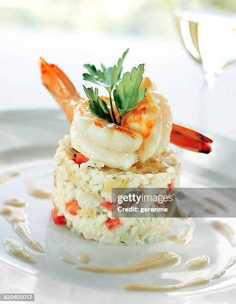 risotto de pescados y mariscos - risotto fotografías e imágenes de stock