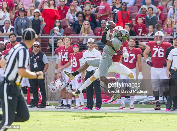 Chidobe Awuzie of the University of Colorado Buffaloes attempts to intercept a pass intended for Trenton Irwin of Stanford during an NCAA Pac-12...
