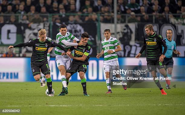 Midfielder Tom Rogic of Celtic FC Glasgow 1888 can't get through the double block of Defender Oscar Wendt of Borussia Moenchengladbach and Forward...