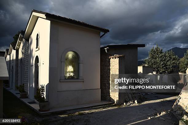 Picture shows damaged graves in the cemetery of Norcia, on November 2, 2016 three days after a 6.5 magnitude earthquake hit central Italy. Some 3,000...