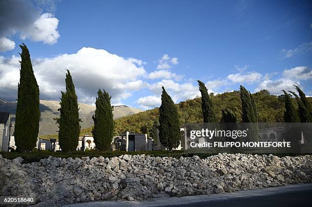 Picture shows the collapsed wall of the cemetery of Norcia, on November 2, 2016 three days after a 6.5 magnitude earthquake hit central Italy. Some...