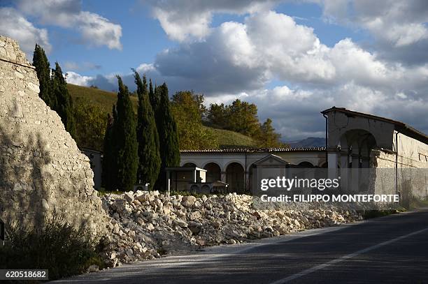 Picture shows the collapsed wall of the cemetery of Norcia, on November 2, 2016 three days after a 6.5 magnitude earthquake hit central Italy. Some...