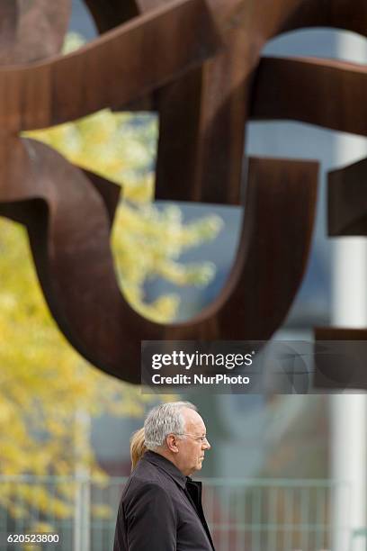 German Chancellor Angela Merkel and Swiss President Johann Schneider-Ammann listen to the national anthems at the Chancellery in Berlin on November...