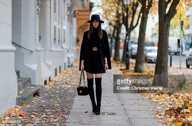 Czech fashion blogger Barbora Ondrackova wearing a black Proenza Schouler turtleneck sweater, a black Topshop Skirt, a black Gucci belt, a black...