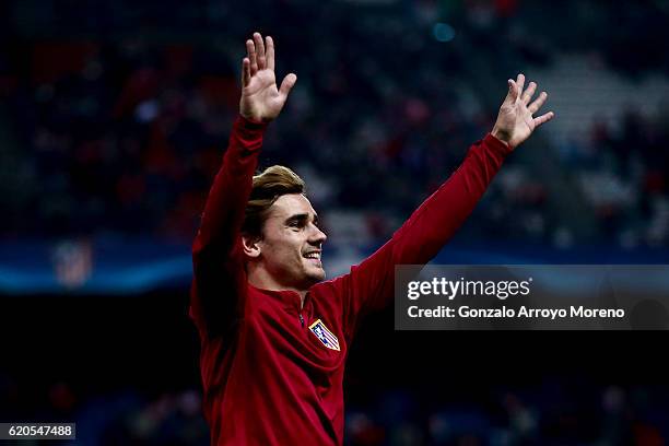 Antoine Griezmann of Atletico de Madrid waves the audience after his warming up before the UEFA Champions League Group D match between Club Atletico...