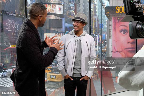 Calloway interviews Nick Cannon during his visit to "Extra" at their New York studios at H&M in Times Square on November 2, 2016 in New York City.