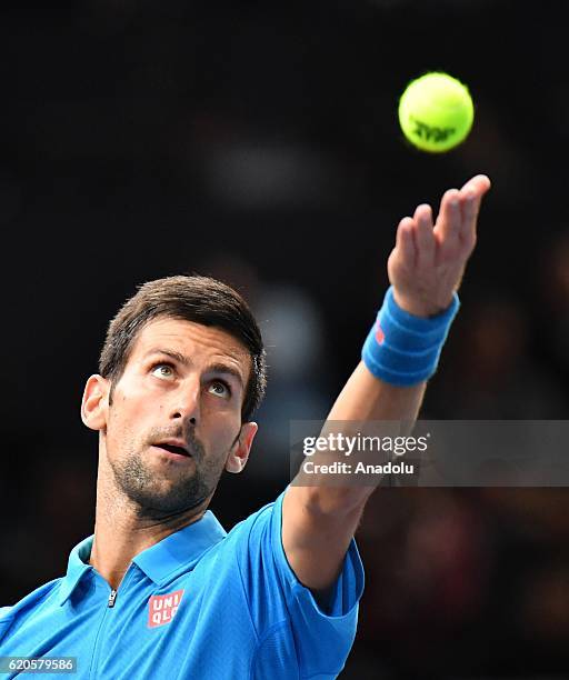 Novak Djokovic of Serbia serves during the Men's second round match against Gilles Muller of Luxembourg on day three of the BNP Paribas Masters at...