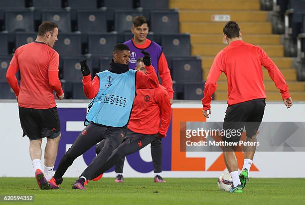 Wayne Rooney, Marcus Rashford and Marcos Rojo of Manchester United in action during a first team training session at Sukru Saracoglu Stadium on...