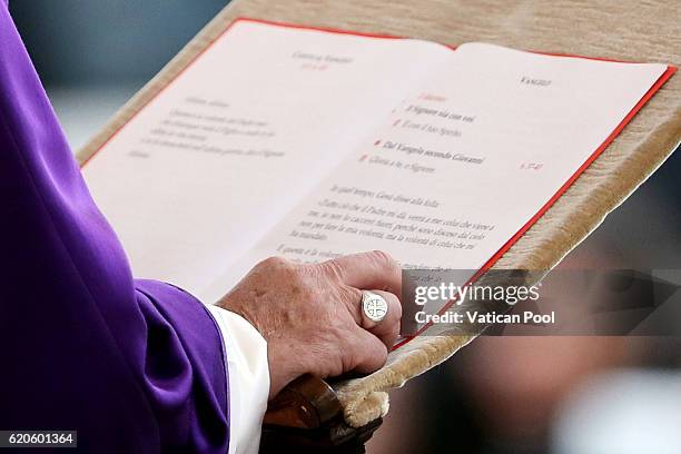 Pope Francis reads a passage from the Gospel, ring detail, as he holds a mass at the Cemetery of Prima Porta 'Cimitero Flaminio' on November 2, 2016...
