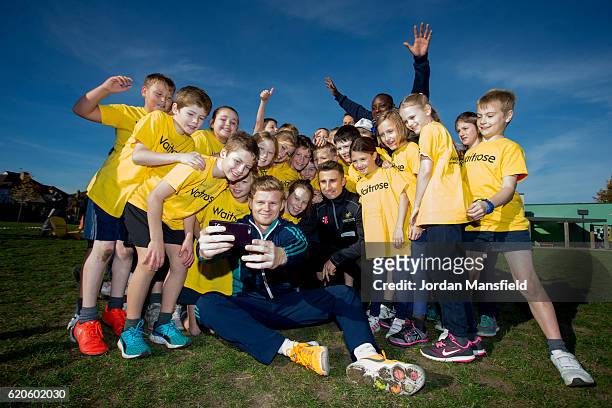 Sam Billings and James Taylor pose for a selfie with students during the Chance to Shine ECB Event at St Mary's and St Peter's CofE Primary on...