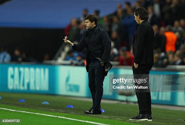 Mauricio Pochettino, Manager of Tottenham Hotspur and Roger Schmidt head coach of Bayer Leverkusen react during the UEFA Champions League Group E...