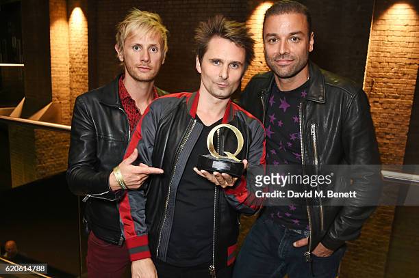 Dominic Howard, Matt Bellamy and Chris Wolstenholme of Muse, winners of the Best Act In The World Today award, pose at The Stubhub Q Awards 2016 at...