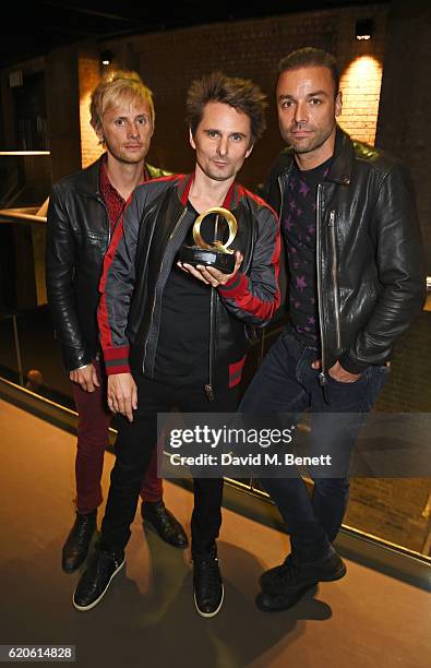 Dominic Howard, Matt Bellamy and Chris Wolstenholme of Muse, winners of the Best Act In The World Today award, pose at The Stubhub Q Awards 2016 at...