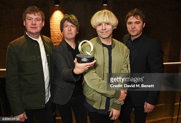 Martin Blunt, Mark Collins, Tim Burgess and Tony Rogers of The Charlatans, winners of the Q Classic Album award for "Tellin' Stories", pose at The...