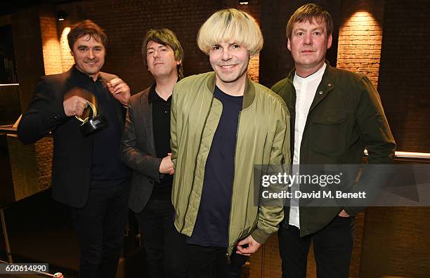 Tony Rogers, Mark Collins, Tim Burgess and Martin Blunt of The Charlatans, winners of the Q Classic Album award for "Tellin' Stories", pose at The...