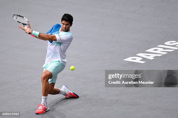 Fernando Verdacso of Spain plays a backhand during the Men's second round match against Andy Murray of Great Britain on day three of the BNP Paribas...