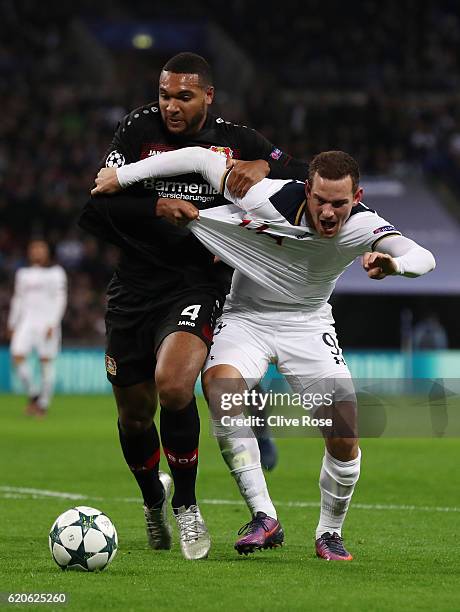 Jonathan Tah of Bayer Leverkusen pulls the shirt of Vincent Janssen of Tottenham Hotspur during the UEFA Champions League Group E match between...