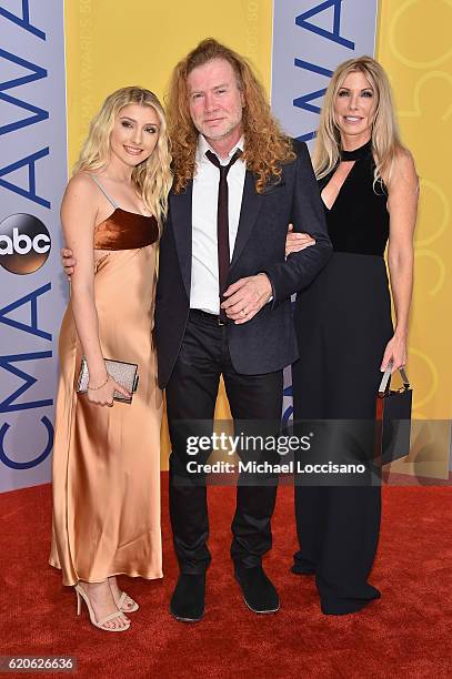 Electra Mustaine, Dave Mustaine, and Pamela Anne Casselberry attend the 50th annual CMA Awards at the Bridgestone Arena on November 2, 2016 in...