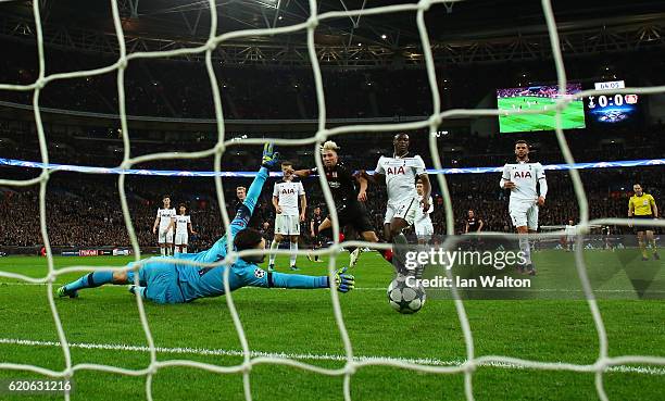 Kevin Kampl of Bayer Leverkusen scores his sides first goal past Hugo Lloris of Tottenham Hotspur during the UEFA Champions League Group E match...