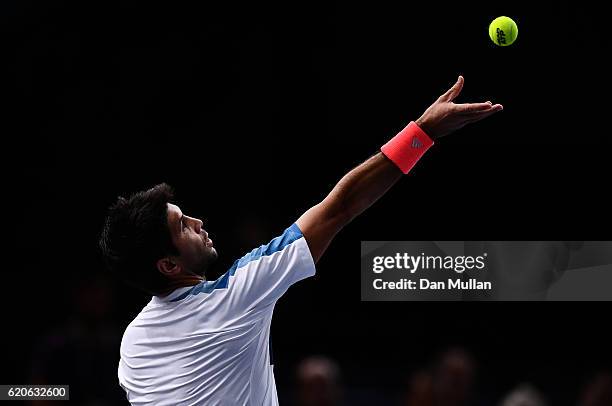 Fernando Verdasco of Spain serves against Andy Murray of Great Britain during the Mens Singles second round match on day three of the BNP Paribas...