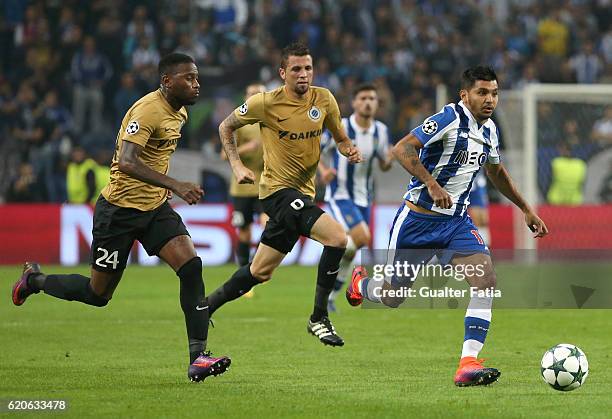 Porto's forward from Mexico Jesus Corona with Club Brugge KV's midfielder Claudemir and Club Brugge KV's defender Stefano Denswil in action during...