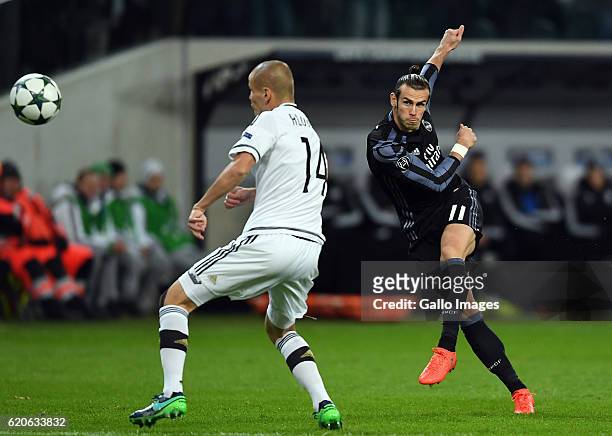 Gareth Bale of Real Madrid scores the team's first goal during the Group Stage of the UEFA Champions League match between Legia Warszawa and Real...