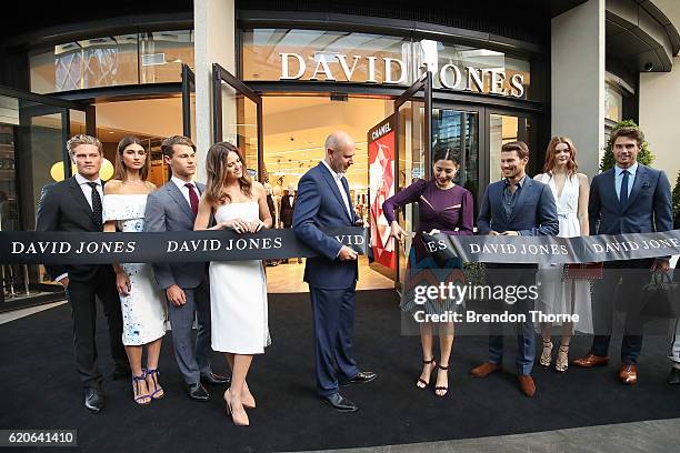 David Jones CEO, John Dixon and David Jones ambassadors, Jesinta Campbell, Jessica Gomes and Jason Dundas cut a symbolic ribbon to open the new David...