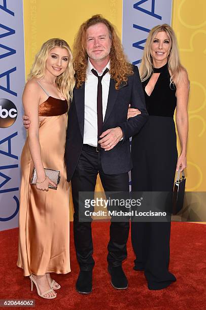 Electra Mustaine, Dave Mustaine, and Pamela Anne Casselberry attend the 50th annual CMA Awards at the Bridgestone Arena on November 2, 2016 in...
