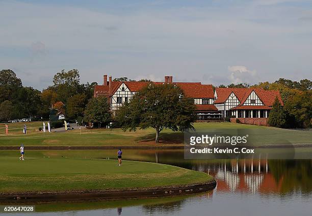 Lisa Maguire of the Duke Blue Devils and Eun Won Park of the Washington Huskies walk the 15th green during day 3 of the 2016 East Lake Cup at East...