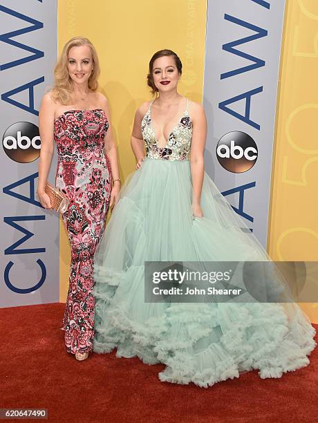 Actress Wendi McLendon-Covey and actress-singer Hayley Orrantia attend the 50th annual CMA Awards at the Bridgestone Arena on November 2, 2016 in...