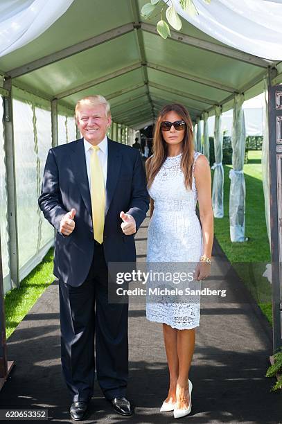 Businessman Donald Trump and his wife Melania at the Trump Invitational Grand Prix at Mar-a-Lago, Palm Beach, Florida, January 4, 2015.