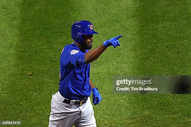 Dexter Fowler of the Chicago Cubs celebrates after hitting a lead off home run in the first inning against the Cleveland Indians in Game Seven of the...