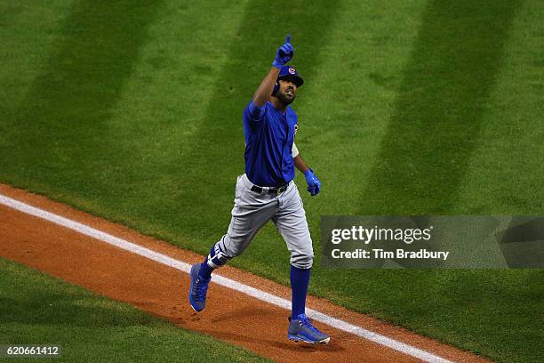 Dexter Fowler of the Chicago Cubs celebrates after hitting a lead off home run in the first inning against the Cleveland Indians in Game Seven of the...