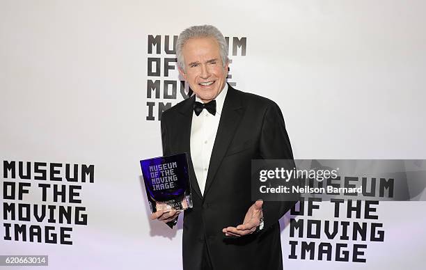 Honoree Warren Beatty poses with his award as he attends Museum Of The Moving Image 30th Annual Salute honoring Warren Beatty at 583 Park Avenue on...