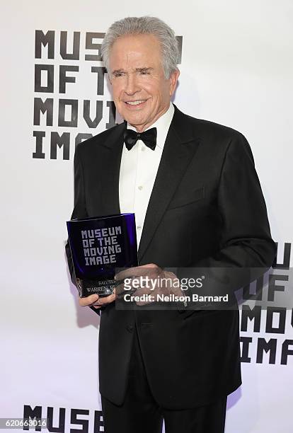 Honoree Warren Beatty poses with his award as he attends Museum Of The Moving Image 30th Annual Salute honoring Warren Beatty at 583 Park Avenue on...