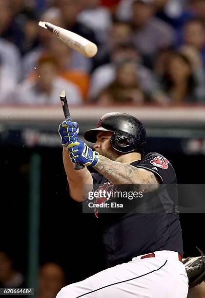 Mike Napoli of the Cleveland Indians breaks his bat during the first inning against the Chicago Cubs in Game Seven of the 2016 World Series at...