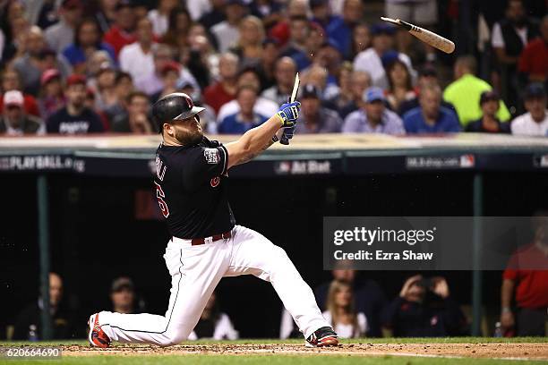 Mike Napoli of the Cleveland Indians breaks his bat during the first inning against the Chicago Cubs in Game Seven of the 2016 World Series at...