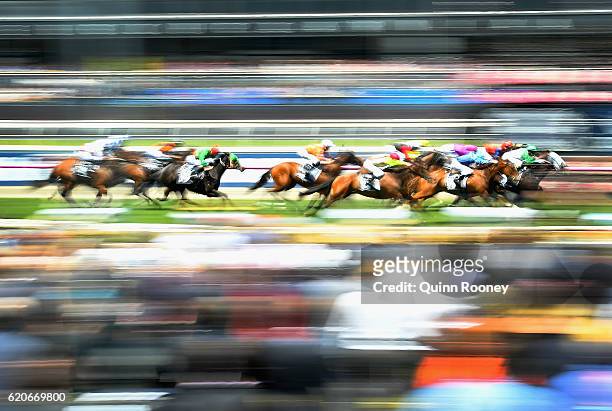 Michelle Payne riding Tavi Bay leads the field across the line to win race 1, the Red Rock Deli Plate on Oaks Day at Flemington Racecourse on...