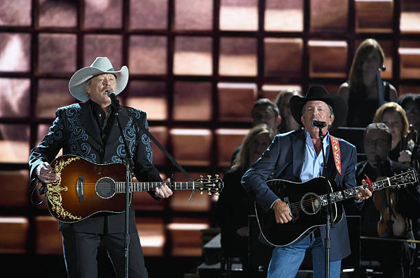Alan Jackson and George Strait perform onstage at the 50th annual CMA Awards at the Bridgestone Arena on November 2, 2016 in Nashville, Tennessee.