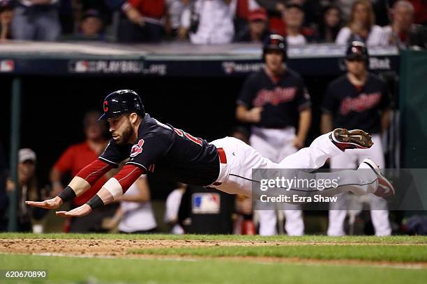 Jason Kipnis of the Cleveland Indians scores a run on a wild pitch thrown by Jon Lester of the Chicago Cubs during the fifth inning in Game Seven of...